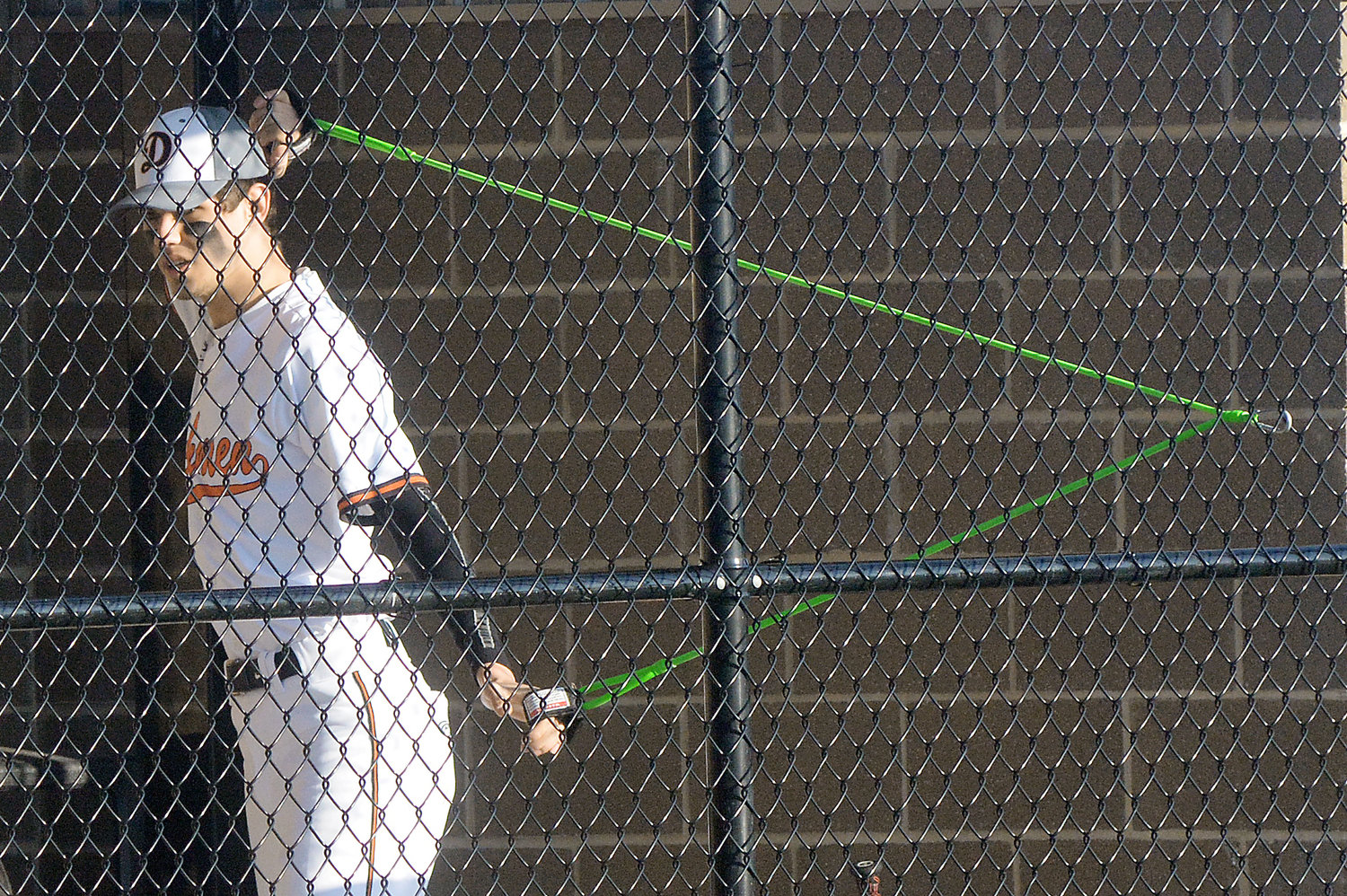 Valley uses elastic bands to stretch his arms before hitting the pitcher’s mound against the Tigers.